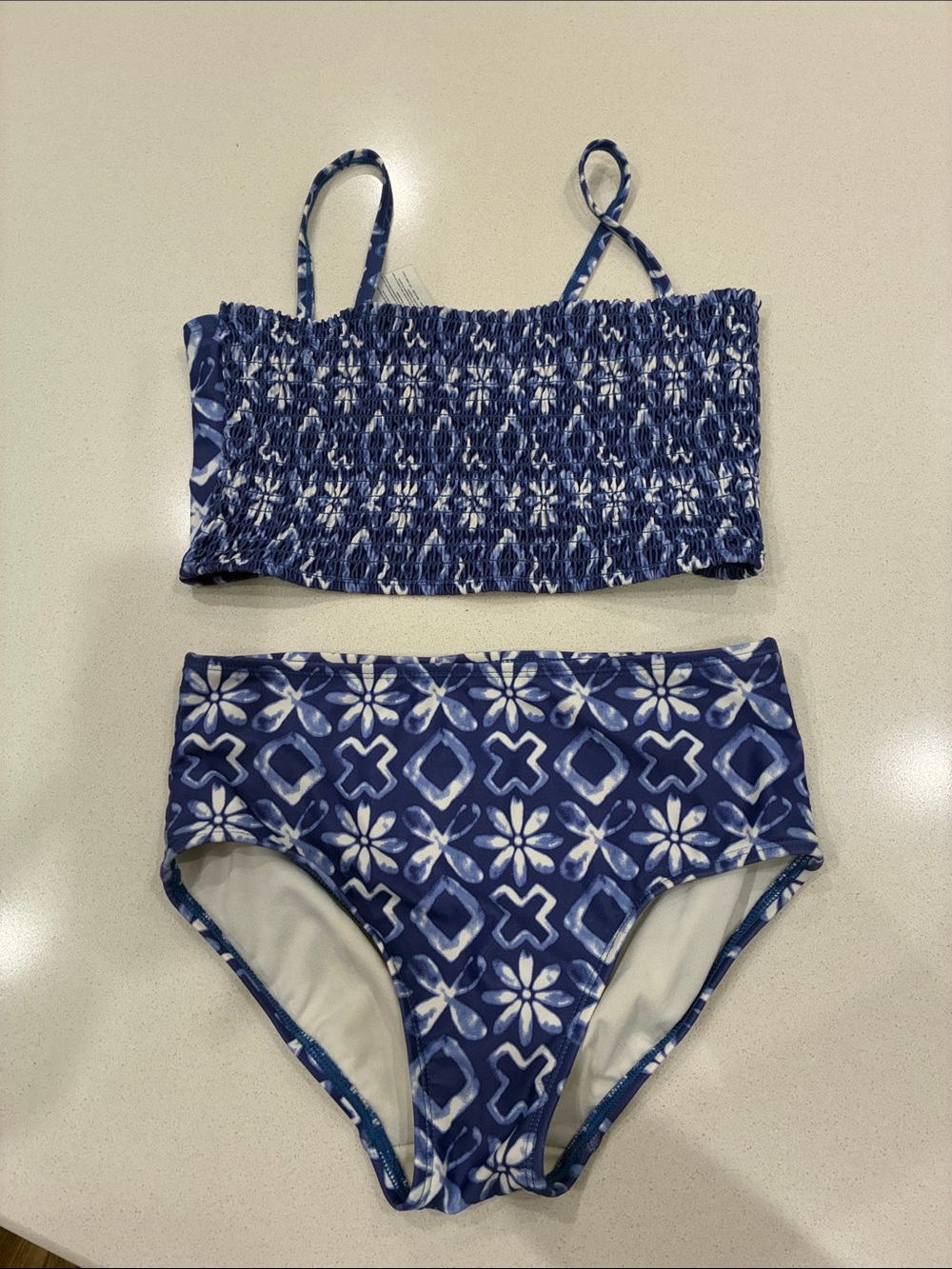 OshKosh B'gosh Blue Floral Tile Smocked Two-Piece Swim Set. Size 12